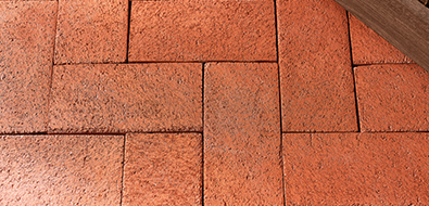Herringbone brick patio in clay red.