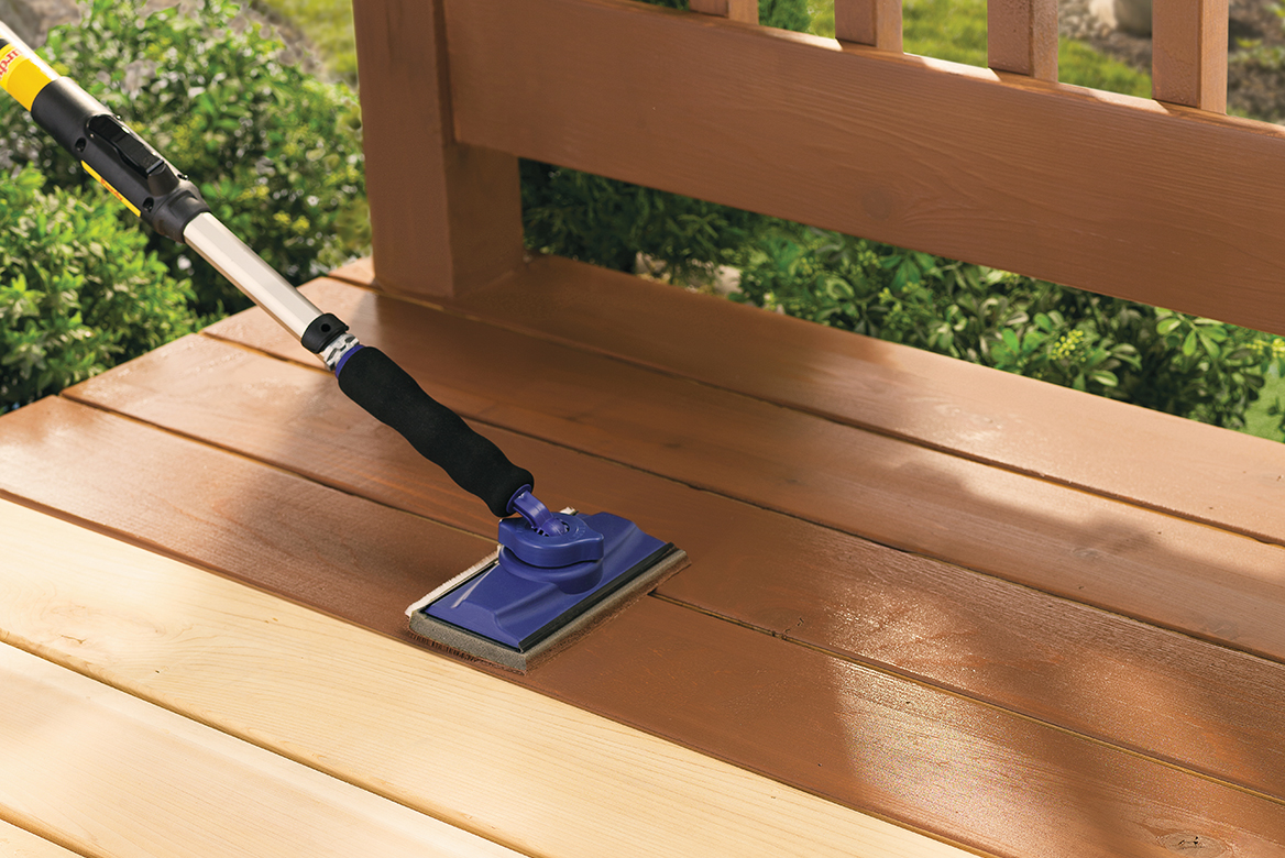 Applying Thompson's WaterSeal Solid Stain Product to Deck with Paint Pad Man Cleaning Deck Prior to Staining